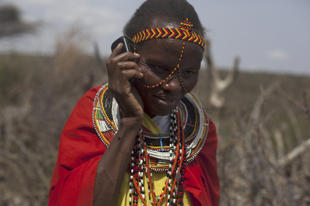 Photo: Mary Kiperus, community health worker, uses a mobile phone for reporting to the local nurse. Leparua village, Isiolo County, Kenya. February, 2014. Christian Aid/Elizabeth Dalziel.